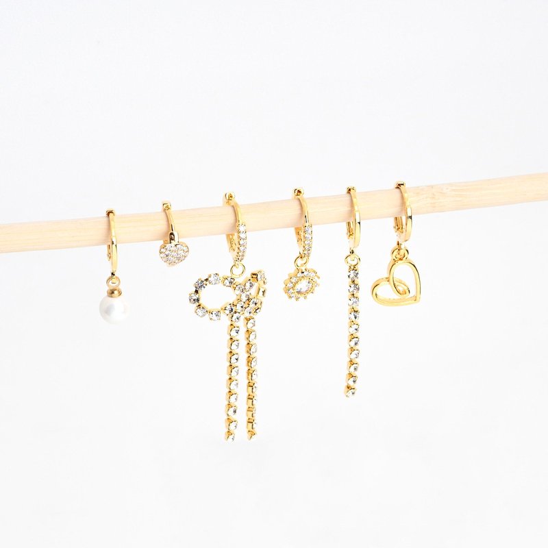 Conjunto brincos banho ouro laço